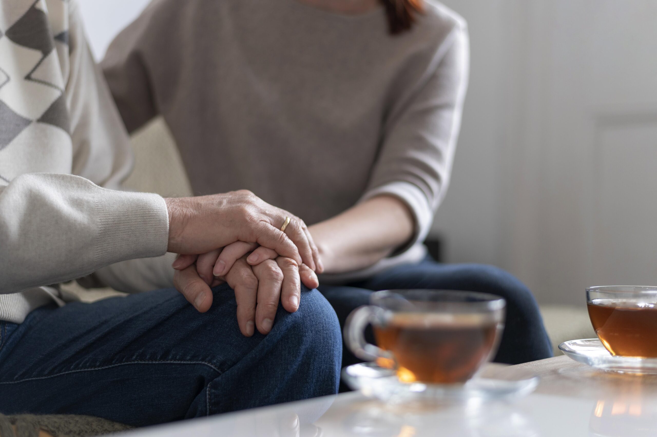 close up people holding hands